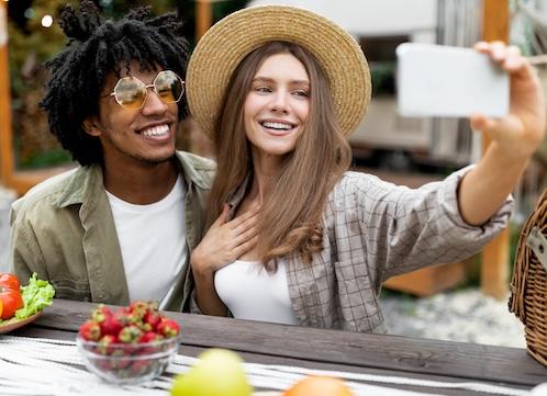 Friends smiling together taking a selfie, scottsdale az