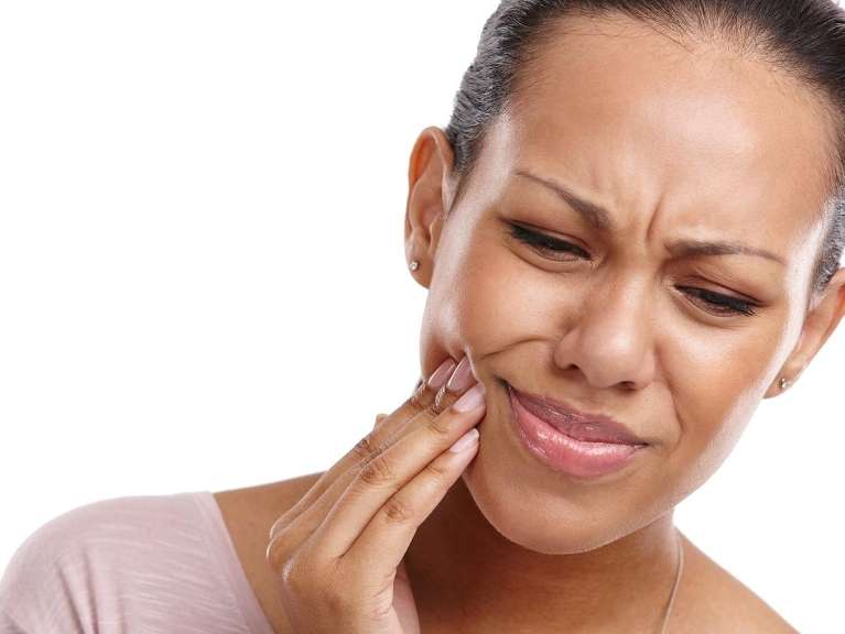 Woman holding her jaw in pain, scottsdale az