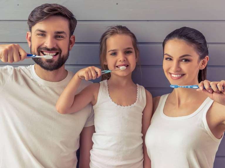 family brushing their teeth in scottsdale az